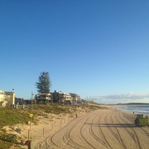 Old club, kiosk, and foredunes. 0km marker